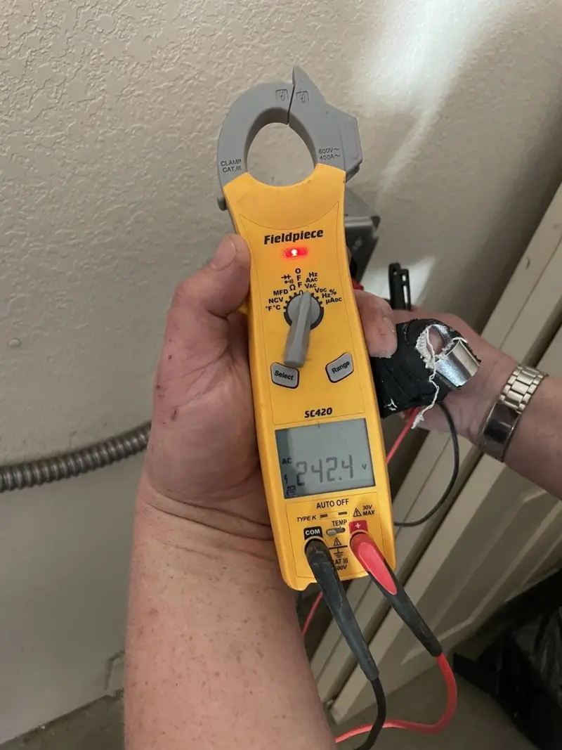 Voltage testing with clamp meter during Hot Tub / Pool Electrical Wiring in Ironwood
